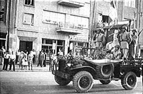  The coup d'鴡t makers (the Shah's troops) carrying the portrait of the Shah, August 19, 1953